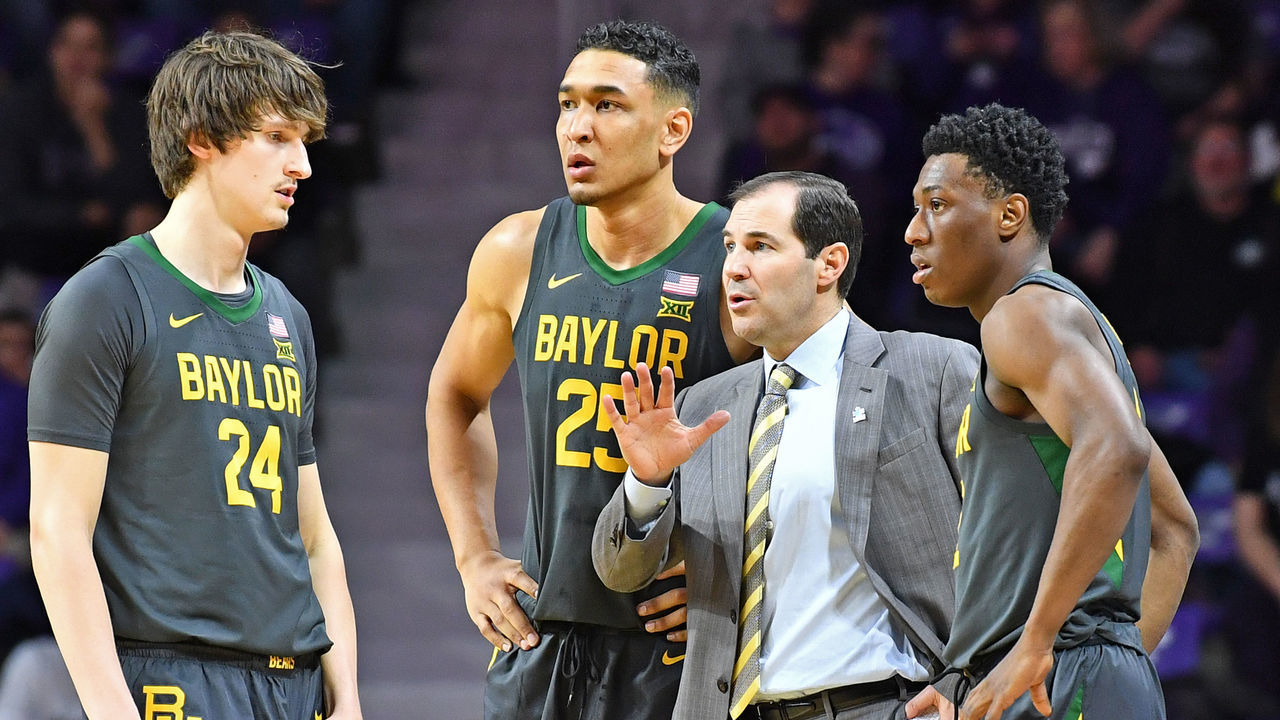 MANHATTAN, KS - FEBRUARY 03: Head coach Scott Drew of the Baylor Bears talks with players Devonte Bandoo #2, Tristan Clark #25 and Matthew Mayer #24, during the first half against the Kansas State Wildcats at Bramlage Coliseum on February 3, 2020 in Manhattan, Kansas.