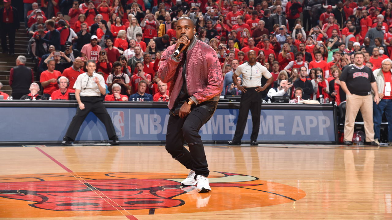 CHICAGO,IL : Recording Artist Kanye West sings for the crowd during a time-out where the Chicago Bulls against the Cleveland Cavaliers at the United Center During Game Four of the Eastern Conference Semifinals during the 2015 NBA Playoffs on May 10, 2015 in Chicago,Illinois NOTE TO USER: User expressly acknowledges and agrees that, by downloading and/or using this Photograph, user is consenting to the terms and conditions of the Getty Images License Agreement. Mandatory Copyright Notice: Copyright 2015 NBAE