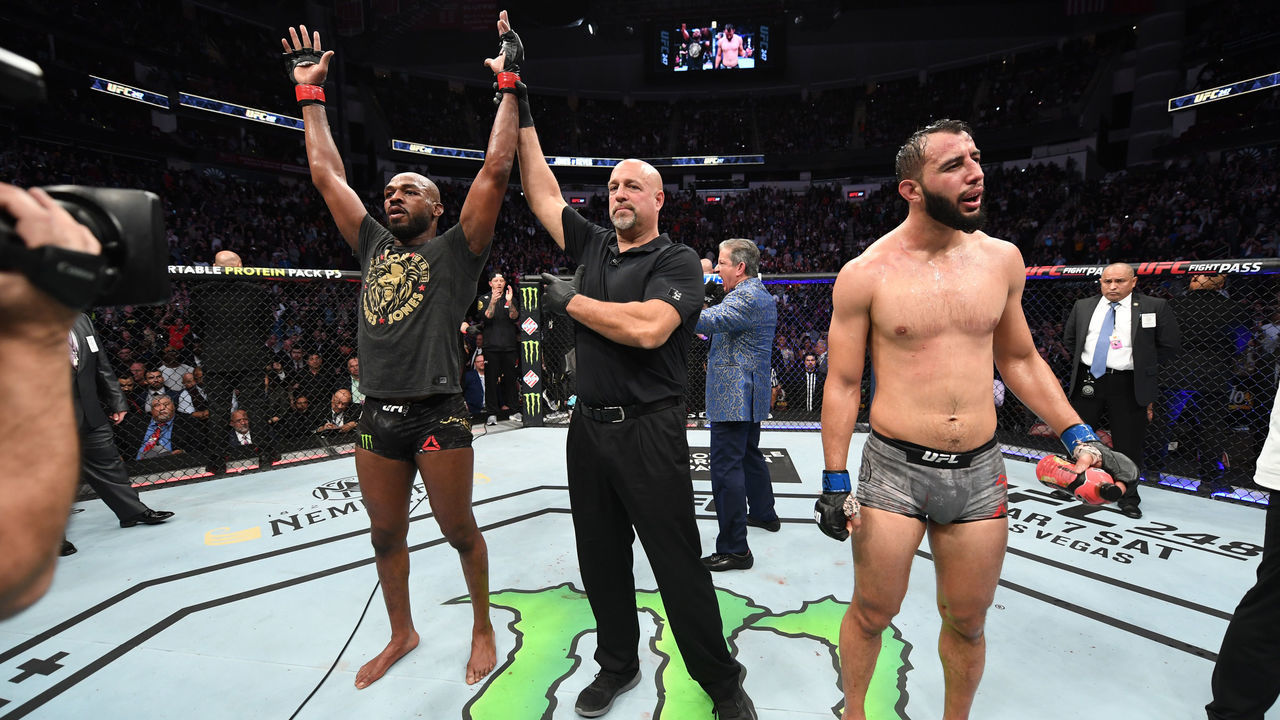 HOUSTON, TEXAS - FEBRUARY 08: (L-R) Jon Jones celebrates his victory over Dominick Reyes in their light heavyweight championship bout during the UFC 247 event at Toyota Center on February 08, 2020 in Houston, Texas.