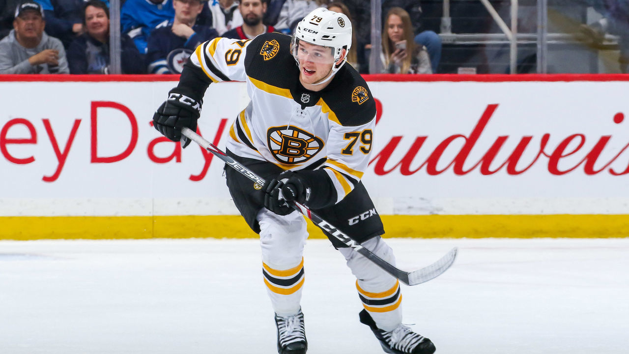 WINNIPEG, MB - JANUARY 31: Jeremy Lauzon #79 of the Boston Bruins follows the play down the ice during third period action against the Winnipeg Jets at the Bell MTS Place on January 31, 2020 in Winnipeg, Manitoba, Canada. The Bruins defeated the Jets 2-1.