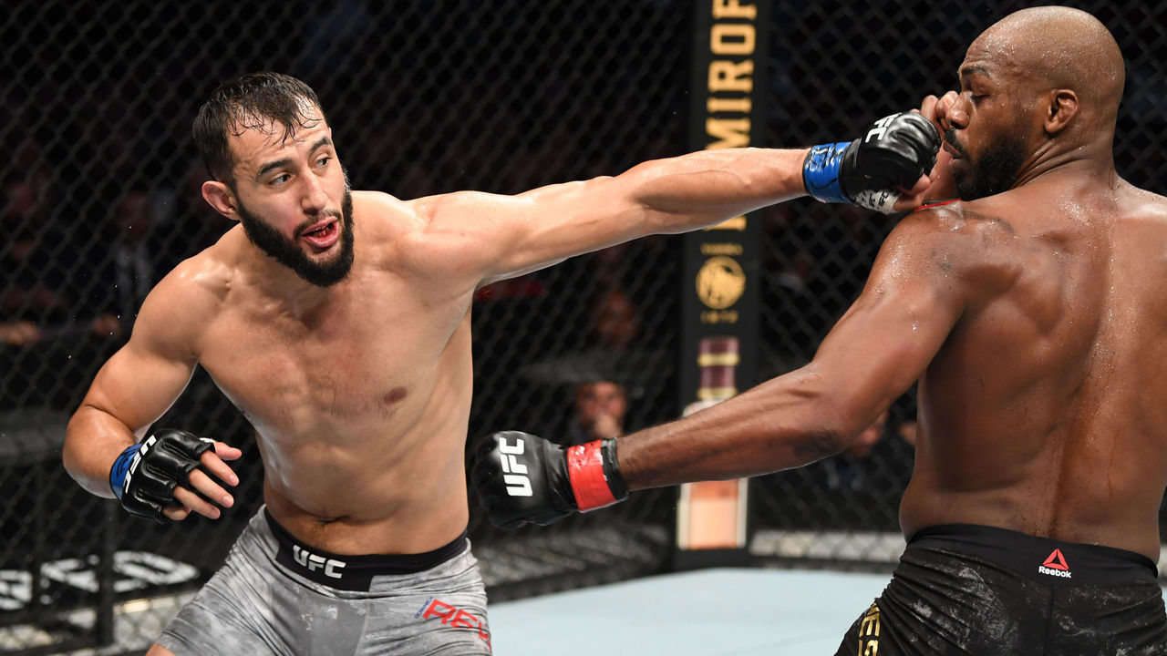 HOUSTON, TEXAS - FEBRUARY 08: (L-R) Dominick Reyes punches Jon Jones in their light heavyweight championship bout during the UFC 247 event at Toyota Center on February 08, 2020 in Houston, Texas.