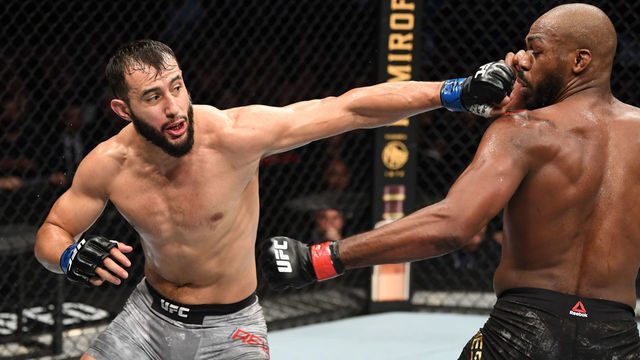 HOUSTON, TEXAS - FEBRUARY 08: (L-R) Dominick Reyes punches Jon Jones in their light heavyweight championship bout during the UFC 247 event at Toyota Center on February 08, 2020 in Houston, Texas.