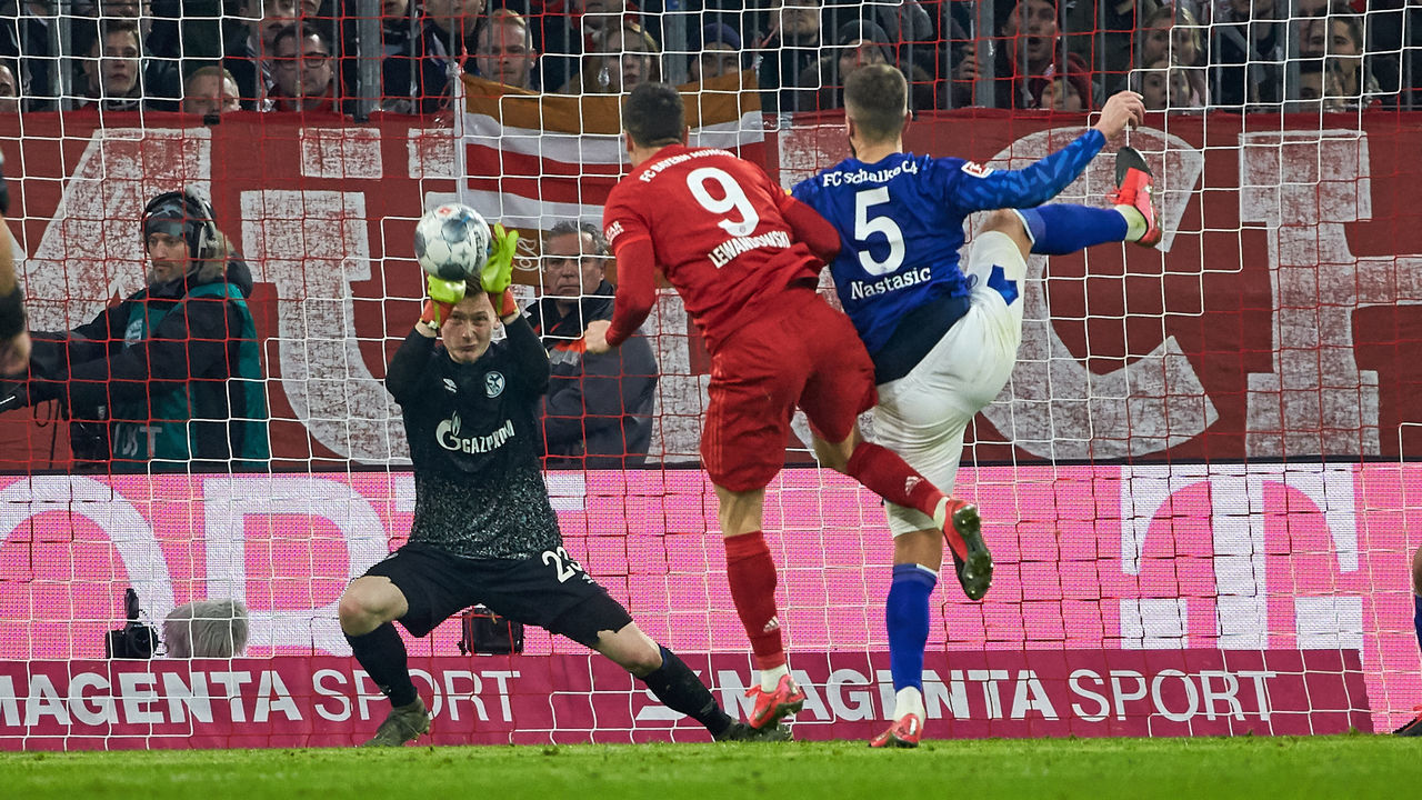 MUNICH, GERMANY - JANUARY 25: (BILD ZEITUNG OUT) goalkeeper Markus Schubert of FC Schalke 04, Robert Lewandowski of FC Bayern Muenchen and Matija Nastasic of FC Schalke 04 battle for the ball during the Bundesliga match between FC Bayern Muenchen and FC Schalke 04 at Allianz Arena on January 25, 2020 in Munich, Germany.
