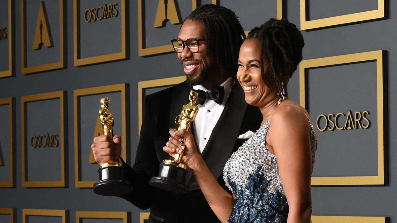 US director Matthew A. Cherry (L) and Karen Rupert Toliver pose in the press room with the Oscar for Best Animated Short Film for "Hair Love" during the 92nd Oscars at the Dolby Theater in Hollywood, California on February 9, 2020.
