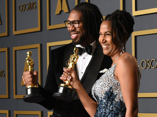 US director Matthew A. Cherry (L) and Karen Rupert Toliver pose in the press room with the Oscar for Best Animated Short Film for "Hair Love" during the 92nd Oscars at the Dolby Theater in Hollywood, California on February 9, 2020.