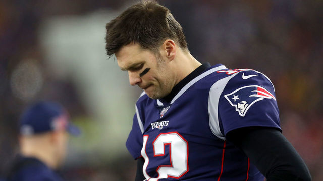 FOXBOROUGH, MASSACHUSETTS - JANUARY 04: Tom Brady #12 of the New England Patriots looks on from the sideline during the the AFC Wild Card Playoff game against the Tennessee Titans at Gillette Stadium on January 04, 2020 in Foxborough, Massachusetts.