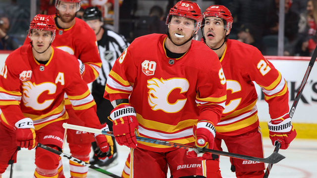 CALGARY, AB - FEBRUARY 6: Sam Bennett #93 of the Calgary Flames celebrates with teammates after a goal against the Nashville Predators at Scotiabank Saddledome on February 6, 2020 in Calgary, Alberta, Canada.