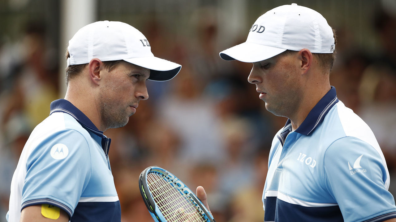 MELBOURNE, AUSTRALIA - JANUARY 22: Bob Bryan and Mike Bryan of the United States talk tactics in their Men's Doubles first round match against Rohan Bopanna of India and Yasutaka Uchiyama of Japan on day three of the 2020 Australian Open at Melbourne Park on January 22, 2020 in Melbourne, Australia.