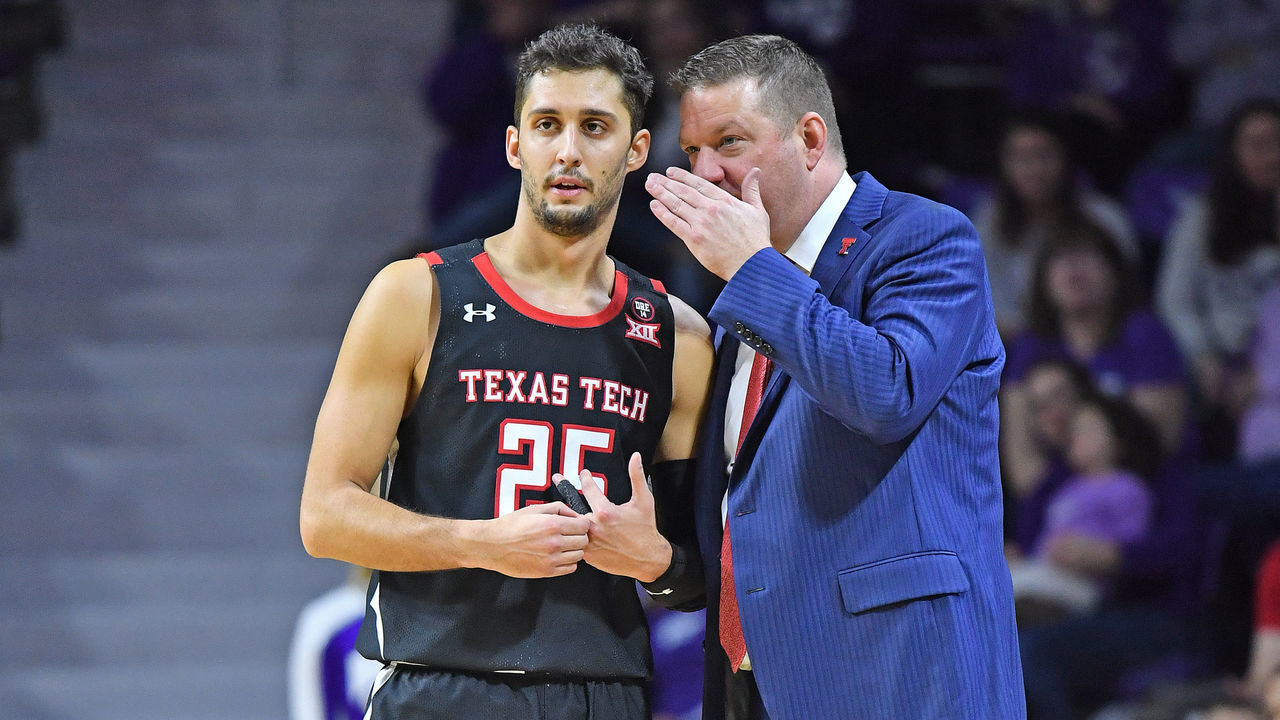 MANHATTAN, KS - JANUARY 14: Head coach Chris Beard of the Texas Tech Red Raiders talks with Davide Moretti #25 during the second half against the Kansas State Wildcats on January 14, 2020 at Bramlage Coliseum in Manhattan, Kansas.