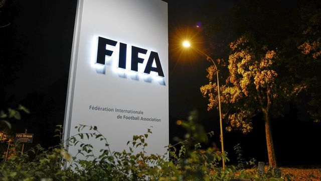 A sign of the FIFA is seen at the entrance of the world football's governing body headquarters on October 13, 2016 in Zurich. / AFP / FABRICE COFFRINI