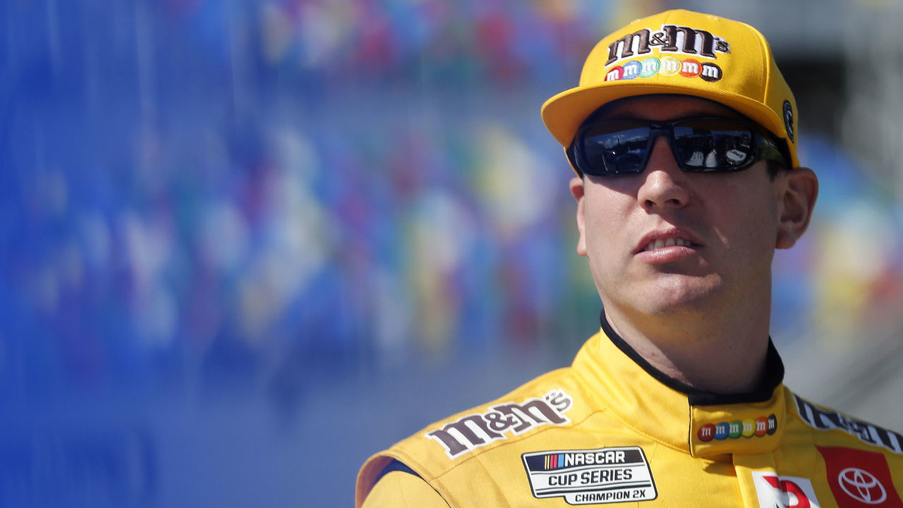 DAYTONA BEACH, FLORIDA - FEBRUARY 09: Kyle Busch, driver of the #18 M&M's Toyota, stands on the grid during qualifying for the NASCAR Cup Series 62nd Annual Daytona 500 at Daytona International Speedway on February 09, 2020 in Daytona Beach, Florida.