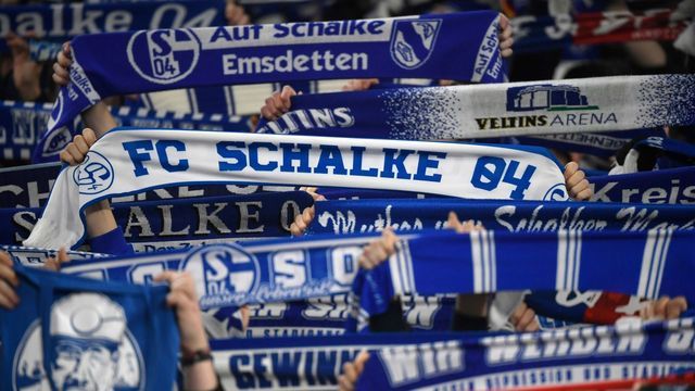 Schalke's supporters celebrate the 2-0 victory after the German first division Bundesliga football match Schalke 04 v Borussia Moenchengladbach in Gelsenkirchen, western Germany, on January 17, 2020.