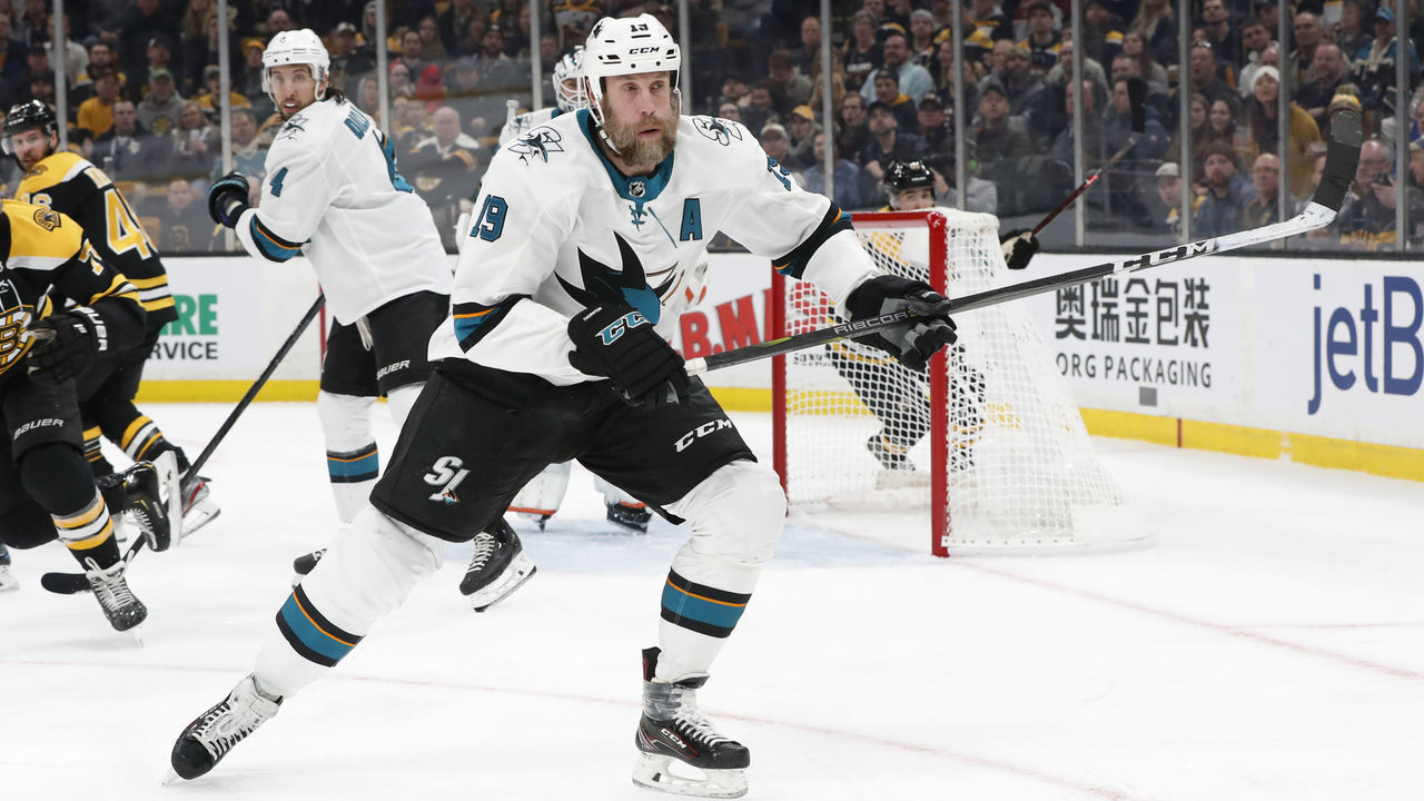 BOSTON, MA - FEBRUARY 26: San Jose Sharks center Joe Thornton (19) chases the puck during a game between the Boston Bruins and the San Jose Sharks on February 26, 2019, at TD Garden in Boston, Massachusetts.