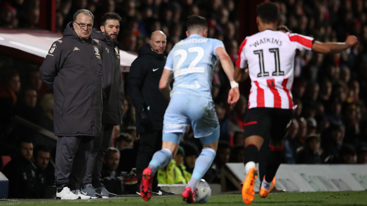 BRENTFORD, ENGLAND - FEBRUARY 11: Leeds manager Marcelo Bielsa watches the action as Jack Harrison of Leeds United battles with Ollie Watkins of Brentford during the Sky Bet Championship match between Brentford and Leeds United at Griffin Park on February 11, 2020 in Brentford, England.
