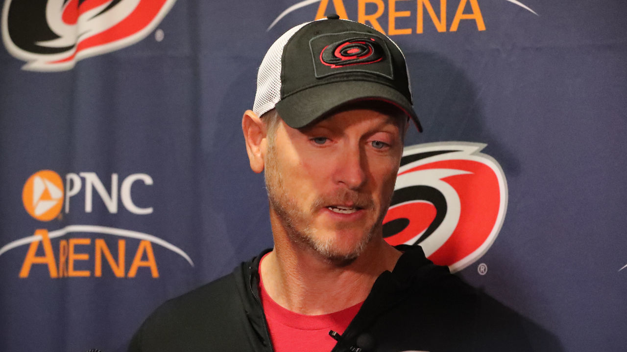RALEIGH, NC - FEBRUARY 19: Carolina Hurricanes owner Tom Dundon gets interviewed before the warmups of the Carolina Hurricanes game versus the New York Rangers on February 19th, 2019 at PNC Arena in Raleigh, NC.