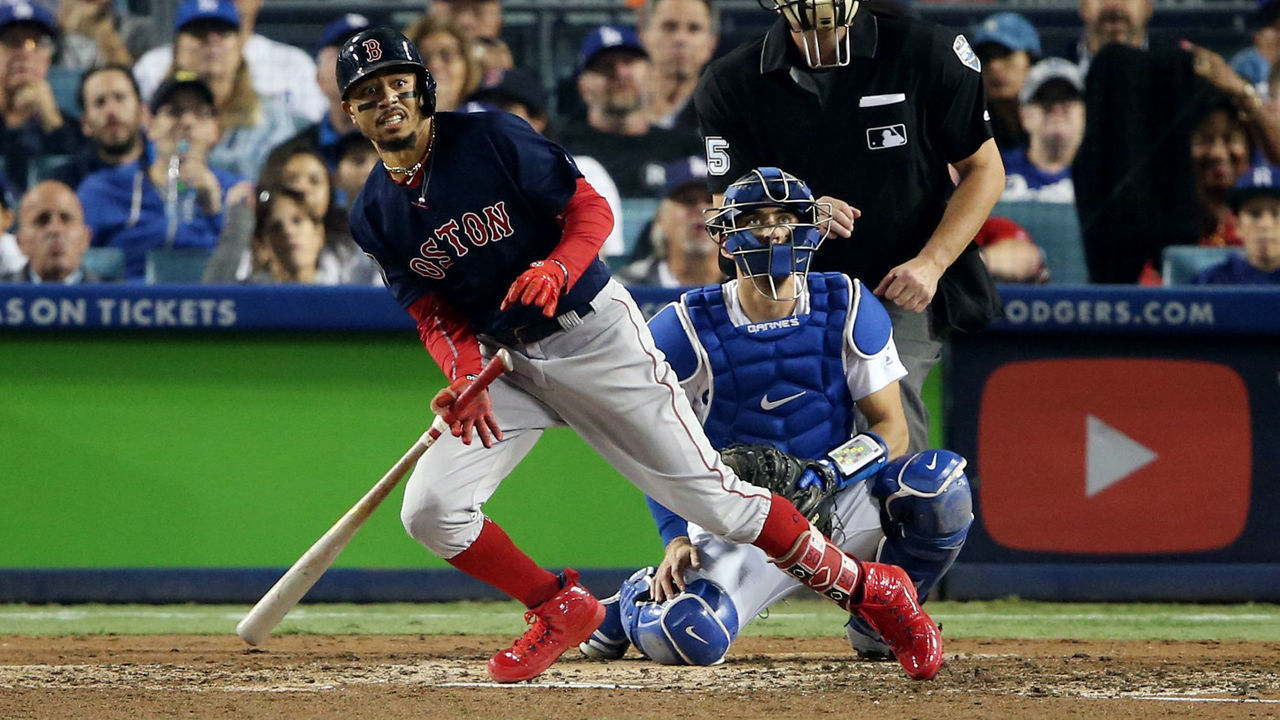 LOS ANGELES, CA - OCTOBER 28: Mookie Betts #50 of the Boston Red Sox hits a solo home run in the sixth inning during Game 5 of the 2018 World Series against the Los Angeles Dodgers at Dodger Stadium on Sunday, October 28, 2018 in Los Angeles, California.