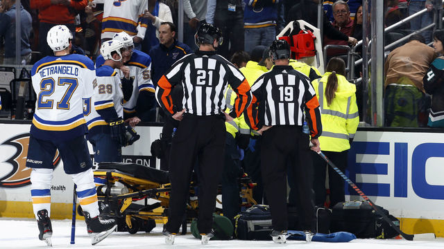ANAHEIM, CA - FEBRUARY 11: The St. Louis Blues watch as the paramedics tend to Jay Bouwmeester #19 of the St. Louis Blues after he collapsed on the bench during the first period of the game against the Anaheim Ducks at Honda Center on February 11, 2020 in Anaheim, California.