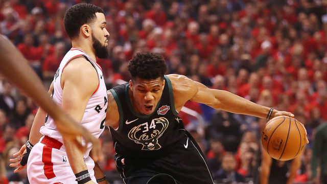 TORONTO, ONTARIO - MAY 25: Giannis Antetokounmpo #34 of the Milwaukee Bucks dribbles against Fred VanVleet #23 of the Toronto Raptors during the first half in game six of the NBA Eastern Conference Finals at Scotiabank Arena on May 25, 2019 in Toronto, Canada.