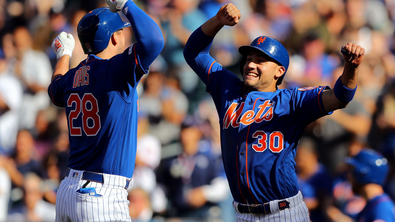 FLUSHING, NY - SEPTEMBER 29: J.D. Davis #28 celebrates with Michael Conforto #30 of the New York Mets after hitting a home run during the game between the Atlanta Braves and the New York Mets at Citi Field on Sunday, September 29, 2019 in Flushing, New York.
