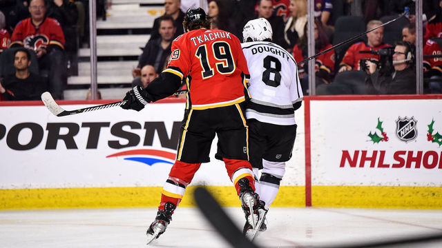 CALGARY, AB - DECEMBER 07: Calgary Flames Left Wing Matthew Tkachuk (19) checks Los Angeles Kings Defenceman Drew Doughty (8) during the third period of an NHL game where the Calgary Flames hosted the Los Angeles Kings on December 7, 2019, at the Scotiabank Saddledome in Calgary, AB.