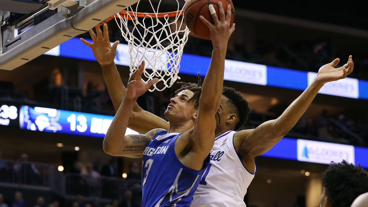 NEWARK, NJ - FEBRUARY 12: Christian Bishop #13 of the Creighton Bluejays attempts a shot as Ike Obiagu #21 of the Seton Hall Pirates defends during the first half of a college basketball game at Prudential Center on February 12, 2020 in Newark, New Jersey.