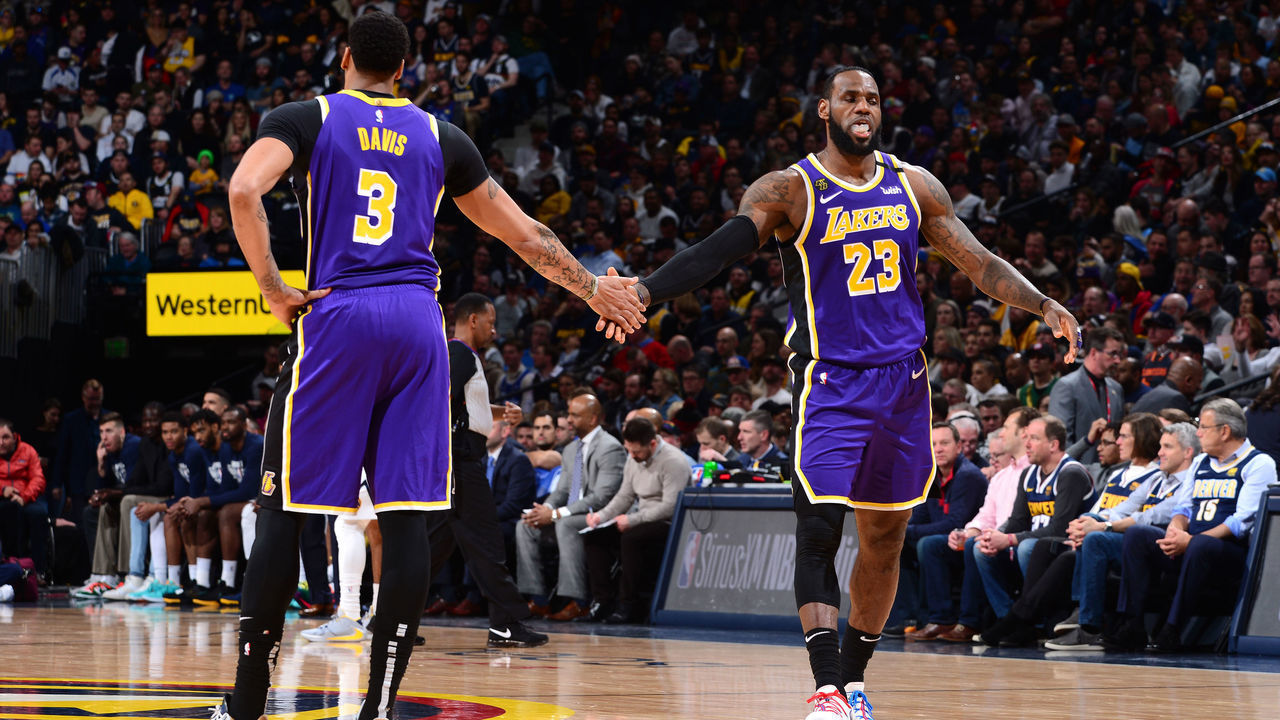 DENVER, CO - FEBRUARY 12: Anthony Davis #3 of the Los Angeles Lakers high-fives LeBron James #23 of the Los Angeles Lakers against the Denver Nuggets on February 12, 2020 at the Pepsi Center in Denver, Colorado. NOTE TO USER: User expressly acknowledges and agrees that, by downloading and/or using this Photograph, user is consenting to the terms and conditions of the Getty Images License Agreement. Mandatory Copyright Notice: Copyright 2020 NBAE