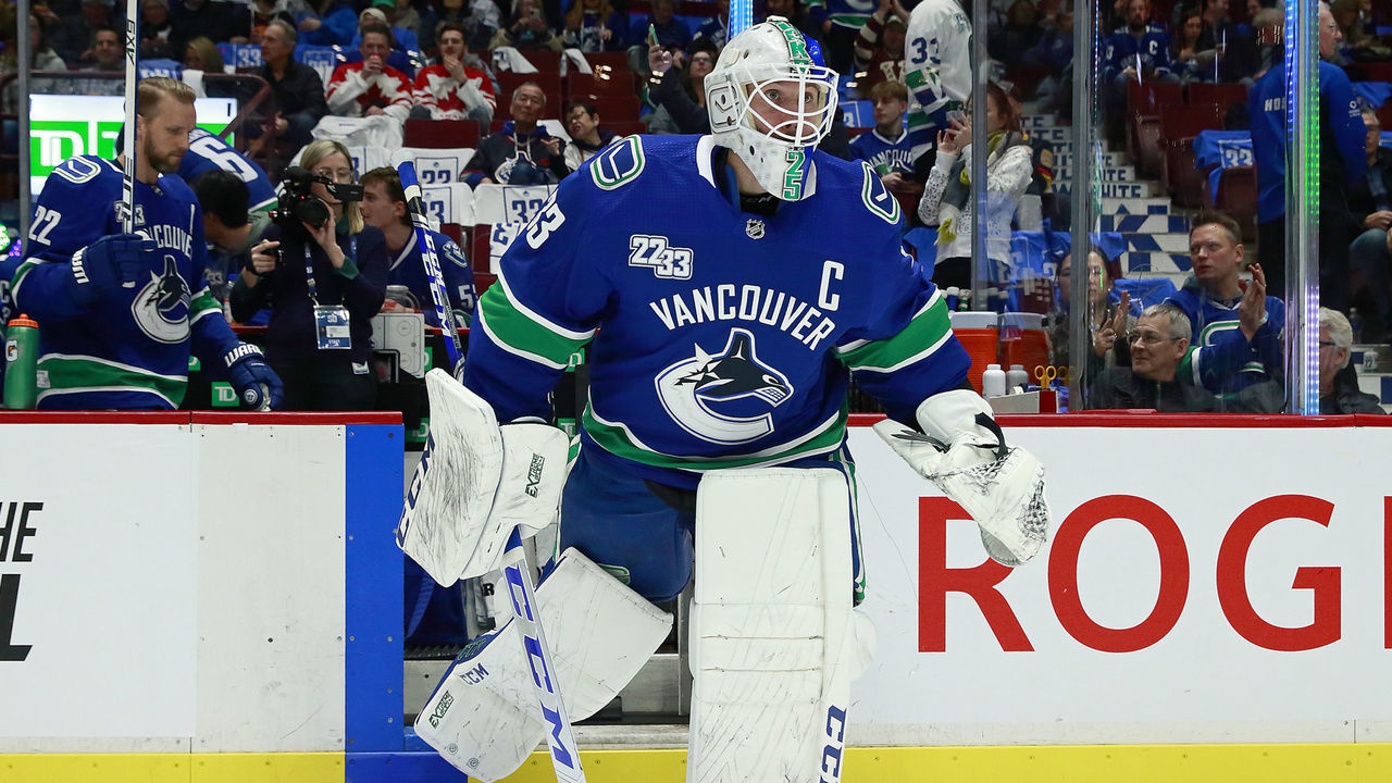VANCOUVER, BC - FEBRUARY 12: Jacob Markstrom #25 of the Vancouver Canucks sports a Daniel Sedin jersey during warmup before their NHL game against the Chicago Blackhawks at Rogers Arena February 12, 2020 in Vancouver, British Columbia, Canada.