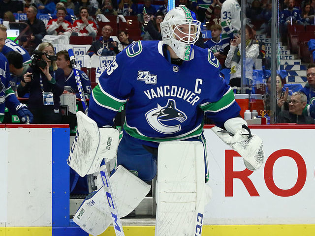 VANCOUVER, BC - FEBRUARY 12: Jacob Markstrom #25 of the Vancouver Canucks sports a Daniel Sedin jersey during warmup before their NHL game against the Chicago Blackhawks at Rogers Arena February 12, 2020 in Vancouver, British Columbia, Canada.
