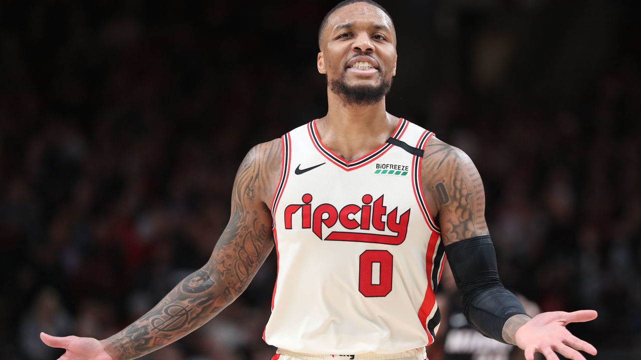 PORTLAND, OREGON - FEBRUARY 09: Damian Lillard #0 of the Portland Trail Blazers reacts to a call in the third quarter against the Miami Heat during their game at Moda Center on February 09, 2020 in Portland, Oregon.