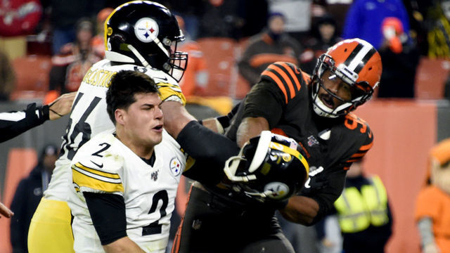 CLEVELAND, OHIO - NOVEMBER 14: Quarterback Mason Rudolph #2 of the Pittsburgh Steelers fights with defensive end Myles Garrett #95 of the Cleveland Browns during the second half at FirstEnergy Stadium on November 14, 2019 in Cleveland, Ohio. The Browns defeated the Steelers 21-7.