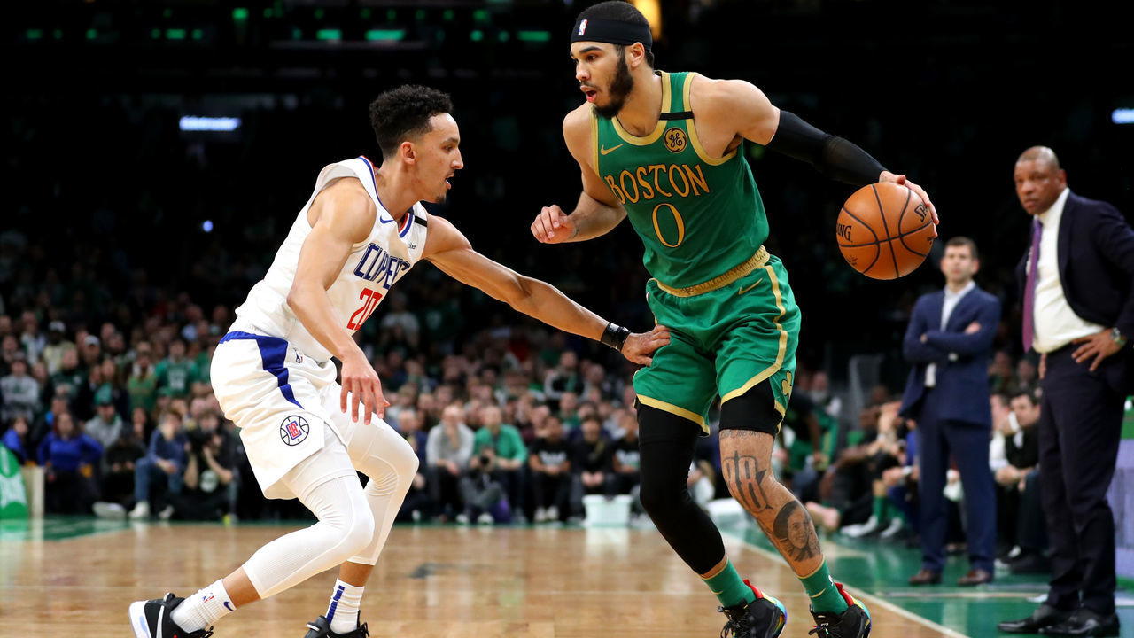 BOSTON, MASSACHUSETTS - FEBRUARY 13: Landry Shamet #20 of the LA Clippers defends Jayson Tatum #0 of the Boston Celtics at TD Garden on February 13, 2020 in Boston, Massachusetts. The Celtics defeat the Clippers in double overtime 141-133.