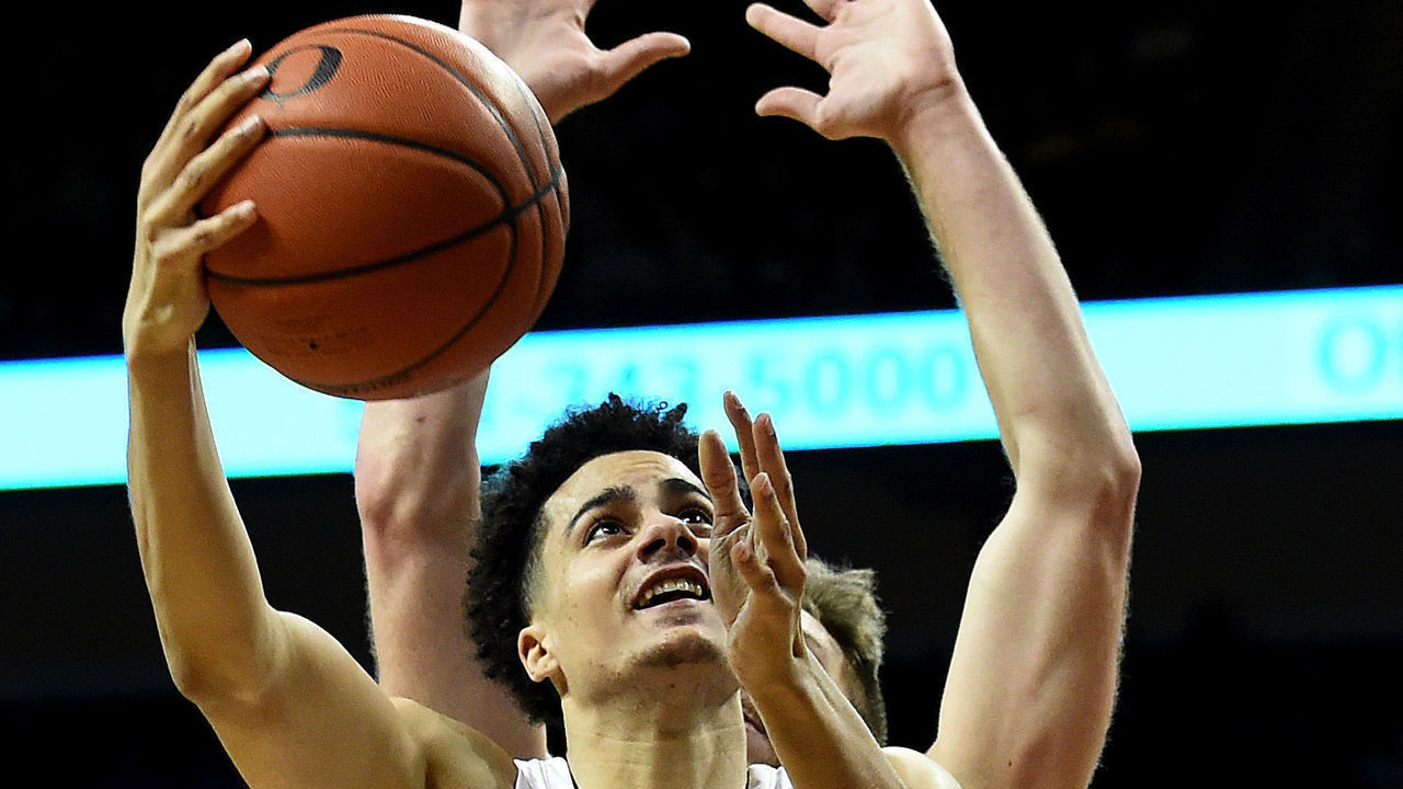 EUGENE, OREGON - FEBRUARY 13: Will Richardson #0 of the Oregon Ducks drives to the basket as Eli Parquet #24 of the Colorado Buffaloes looks on during the first half at Matthew Knight Arena on February 13, 2020 in Eugene, Oregon.