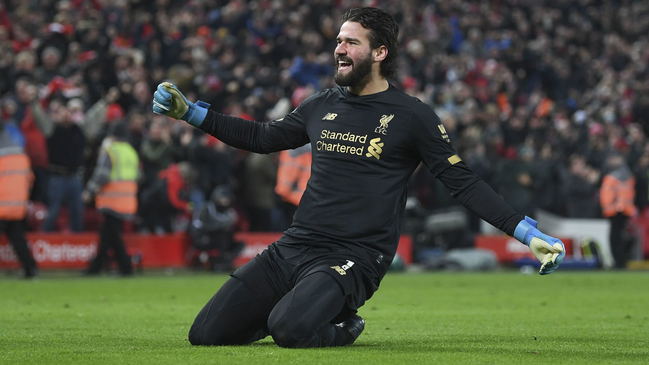LIVERPOOL, ENGLAND - JANUARY 19: Alisson Becker of Liverpool celebrates the 2nd goal during the Premier League match between Liverpool FC and Manchester United at Anfield on January 19, 2020 in Liverpool, United Kingdom.