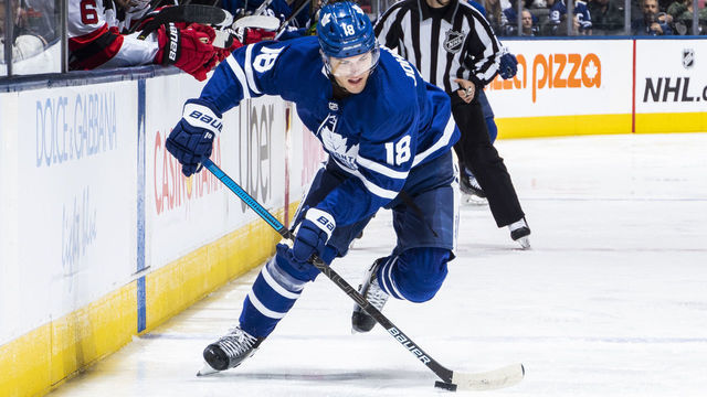 TORONTO, ON - JANUARY 14: Andreas Johnsson #18 of the Toronto Maple Leafs plays the puck against the New Jersey Devils during the first period at the Scotiabank Arena on January 14, 2020 in Toronto, Ontario, Canada.