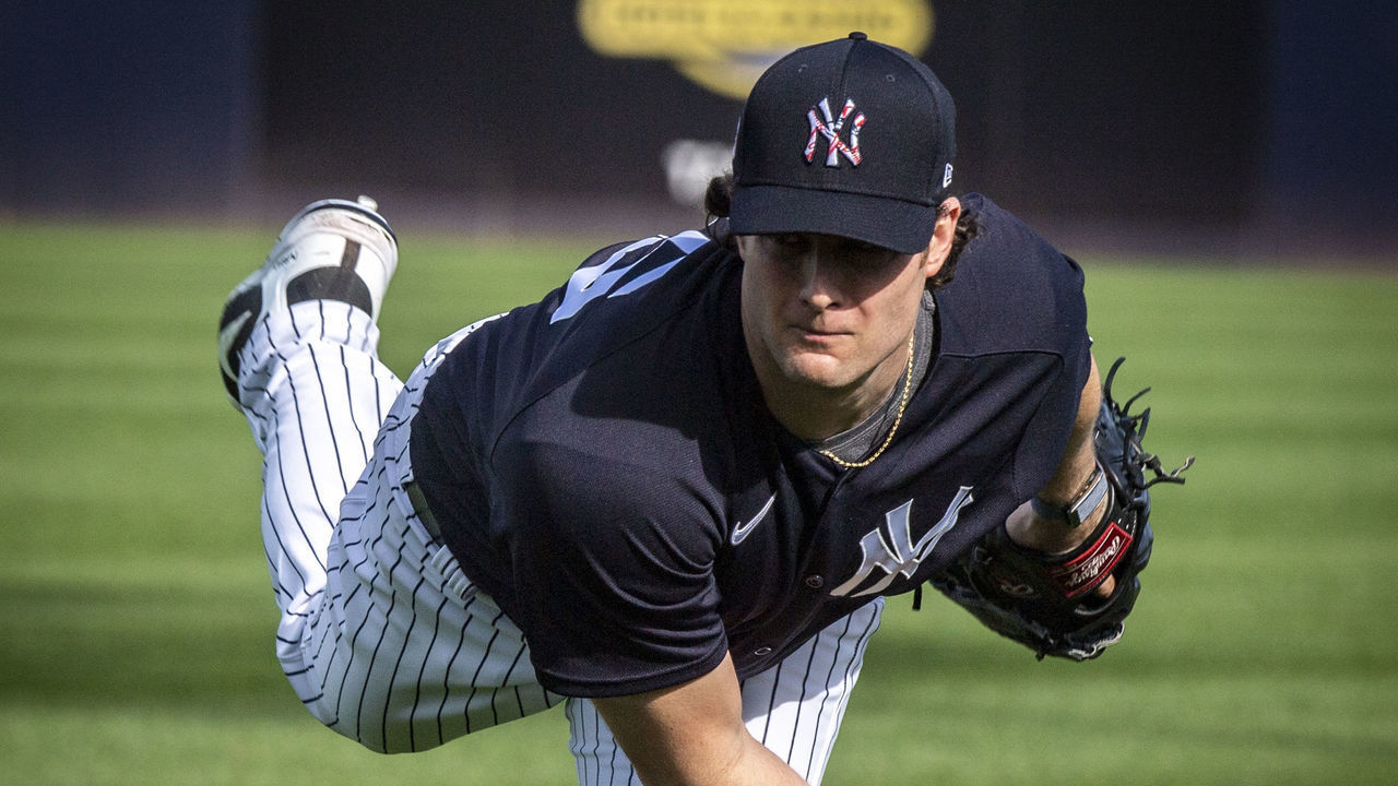 Tampa, Florida: New York Yankees' pitcher Gerrit Cole warms up in the bullpen with pitching coach Matt Blake looking on on the first day of spring training in Tampa, Florida on February 12, 2020.