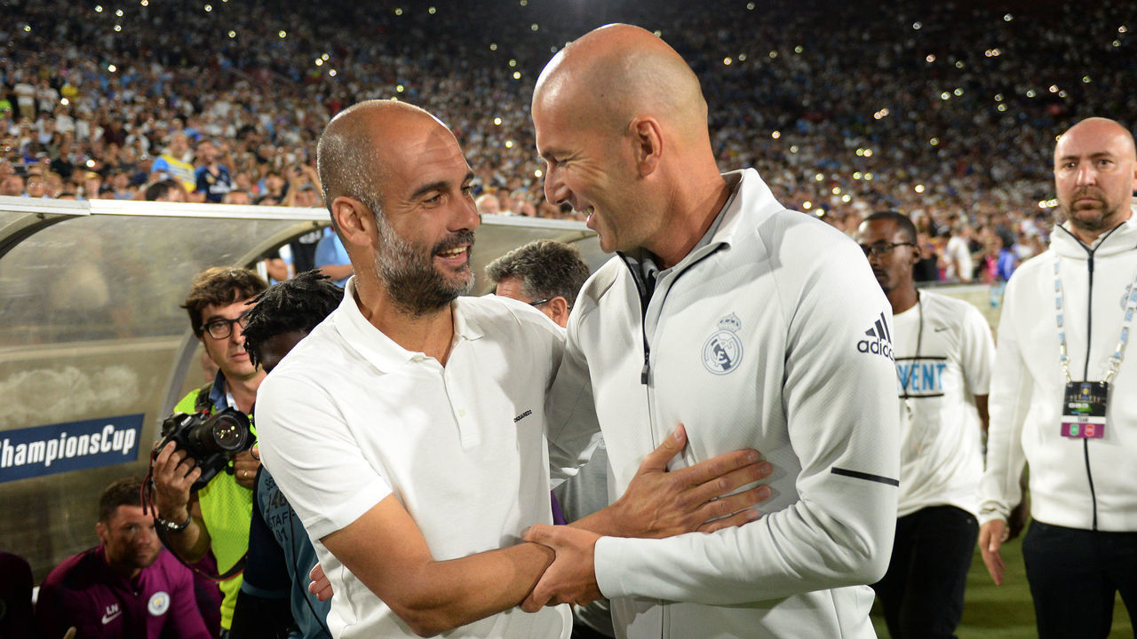 LOS ANGELES, CA - JULY 26: Coach Pep Guardiola (L) of Manchester City and coach Zinedine Zidane of Real Madrid hug before the stat of the International Champions Cup 2017 soccer match at the Los Angeles Coliseum July 26, 2017, in Los Angeles, California.
