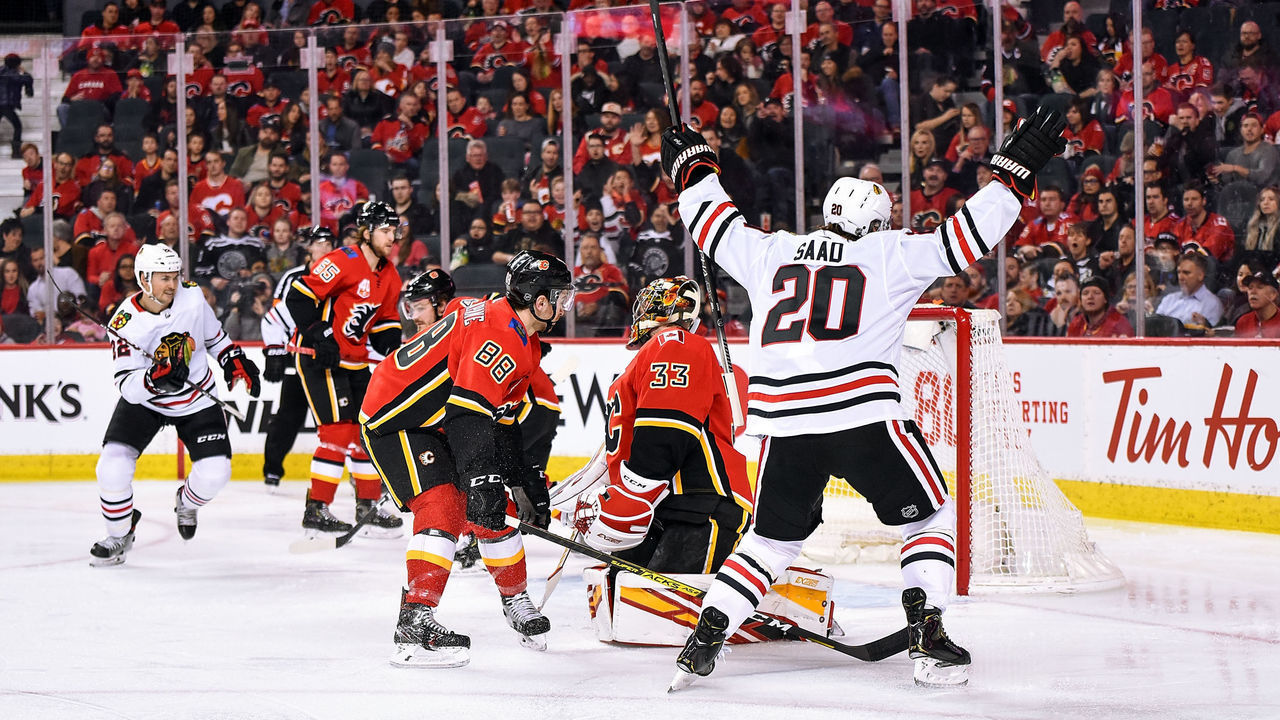 CALGARY, AB - FEBRUARY 15: Chicago Blackhawks Left Wing Brandon Saad (20) celebrates after scoring a goal on Calgary Flames Goalie David Rittich (33) during the second period of an NHL game on February 15, 2020, at the Scotiabank Saddledome in Calgary, AB.