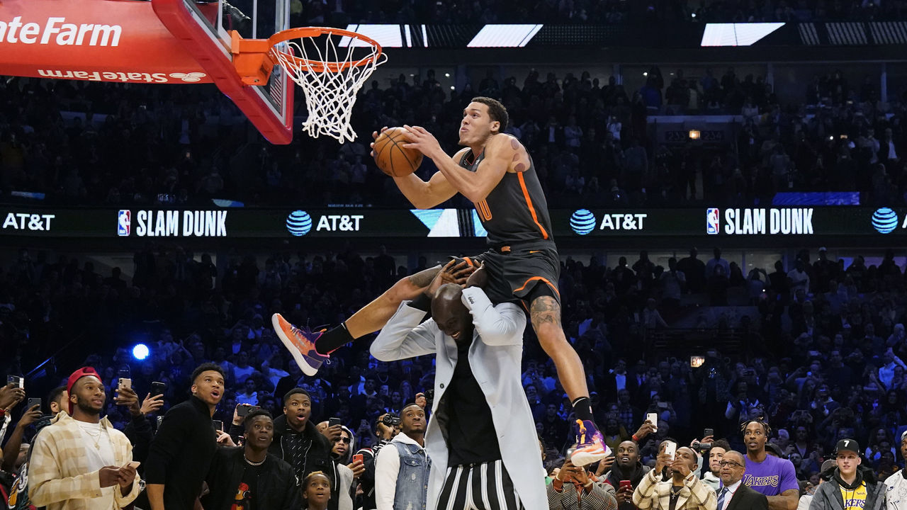 CHICAGO, IL - FEBRUARY 15: (Dunk Sequence 15 of 22) Aaron Gordon #00 of the Orlando Magic dunks the ball over Tacko Fall #99 of the Boston Celtics during the AT&T Slam Dunk as part of 2020 NBA All-Star Weekend on February 15, 2020 at United Center in Chicago, Illinois. NOTE TO USER: User expressly acknowledges and agrees that, by downloading and/or using this Photograph, user is consenting to the terms and conditions of the Getty Images License Agreement. Mandatory Copyright Notice: Copyright 2020 NBAE