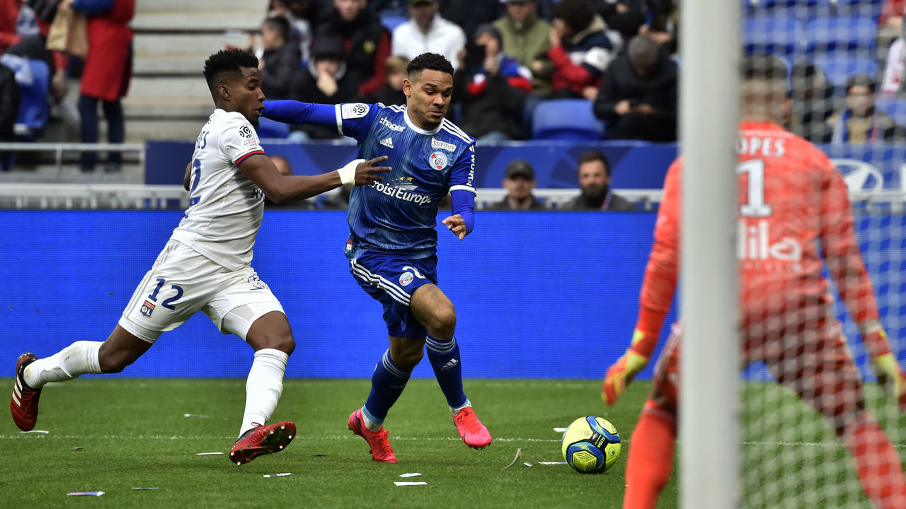 Lyon's Brazilian midfielder Thiago Mendes (L) vies for the ball with Strasbourg's French defender Kenny Lala (R) during the French L1 football match between Lyon (OL) and Strasbourg (RCSA) on February 16, 2020 at the Groupama stadium in Decines-Charpieu near Lyon, southeastern France.