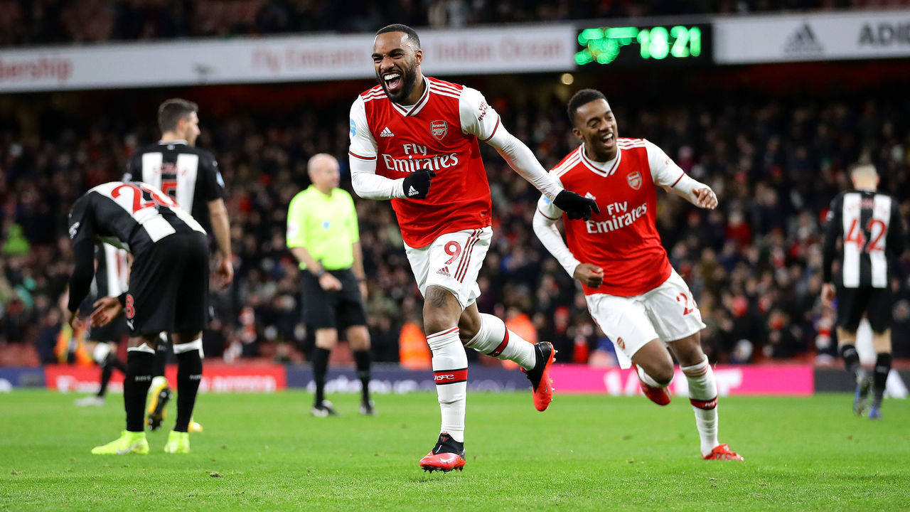 LONDON, ENGLAND - FEBRUARY 16: Alexandre Lacazette of Arsenal celebrates after scoring his sides fourth goal during the Premier League match between Arsenal FC and Newcastle United at Emirates Stadium on February 16, 2020 in London, United Kingdom.