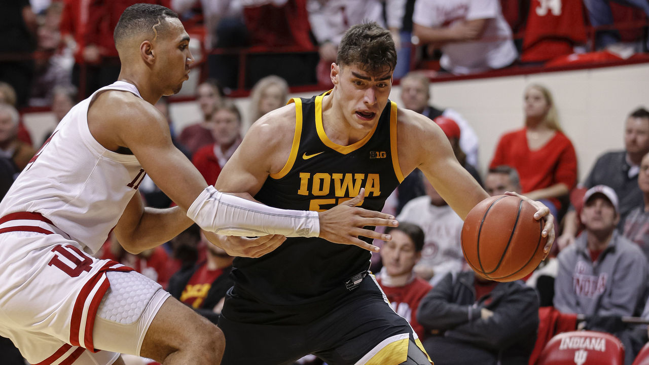 BLOOMINGTON, IN - FEBRUARY 13: Luka Garza #55 of the Iowa Hawkeyes dribbles the ball against Trayce Jackson-Davis #4 of the Indiana Hoosiers at Assembly Hall on February 13, 2020 in Bloomington, Indiana.
