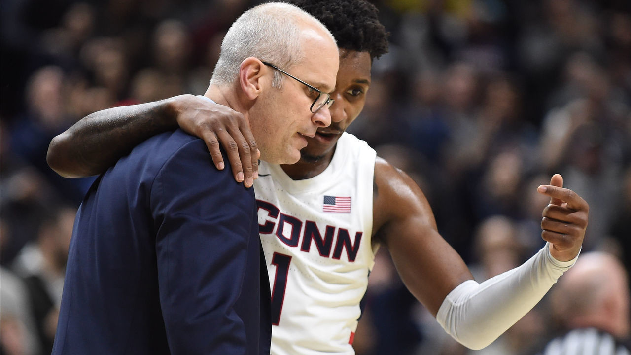 STORRS, CT - FEBRUARY 09: UConn Huskies guard Christian Vital (1) and UConn Huskies head coach Dan Hurley discusses a play during the game as the Cincinnati Bearcats take on the UConn Huskies on February 9, 2020, at Gampel Pavilion in Storrs, Connecticut.