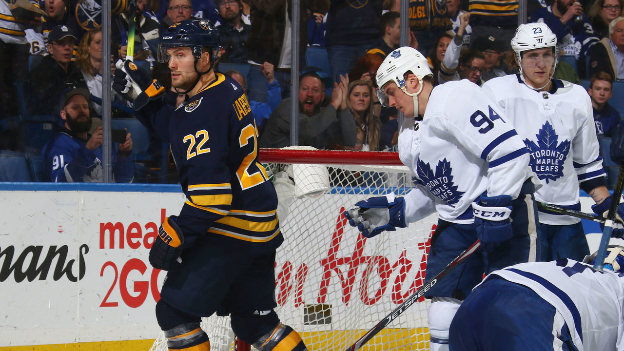 BUFFALO, NY - FEBRUARY 16: Johan Larsson #22 of the Buffalo Sabres celebrates his goal against Frederik Andersen #31 of the Toronto Maple Leafs during an NHL game on February 16, 2020 at KeyBank Center in Buffalo, New York.