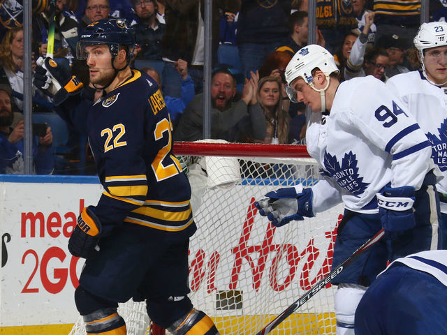 BUFFALO, NY - FEBRUARY 16: Johan Larsson #22 of the Buffalo Sabres celebrates his goal against Frederik Andersen #31 of the Toronto Maple Leafs during an NHL game on February 16, 2020 at KeyBank Center in Buffalo, New York.
