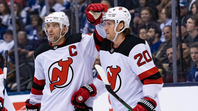 TORONTO, ON - JANUARY 14: New Jersey Devils Defenceman Andy Greene (6) congratulates New Jersey Devils Winger Blake Coleman (20) on his goal during the NHL regular season game between the New Jersey Devils and the Toronto Maple Leafs on January 14, 2019, at Scotiabank Arena in Toronto, ON, Canada.