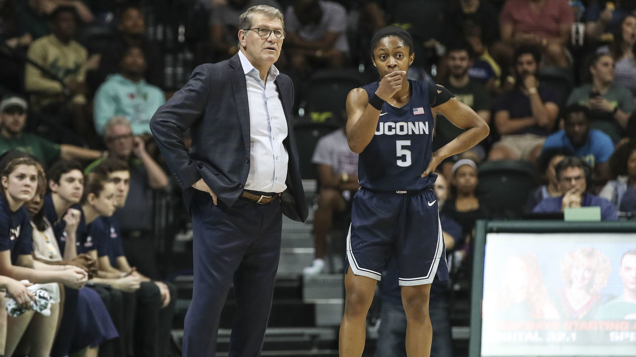 TAMPA, FL - FEBRUARY 16: UConn Huskies head coach Geno Auriemma talks to UConn Huskies guard Crystal Dangerfield (5) during the women's college basketball game between the Connecticut Huskies and South Florida Bulls on February 16, 2020 at the Yuengling Center in Tampa, FL.