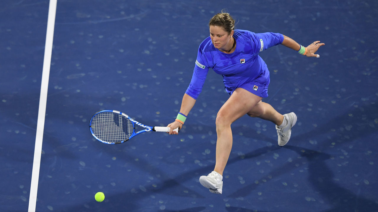 Kim Clijsters of the Belgium returns the ball to Garbine Muguruza of Spain during the WTA Dubai Duty Free Tennis Championship, at the Dubai Tennis Stadium in the United Arab Emirates, on February 17, 2020.