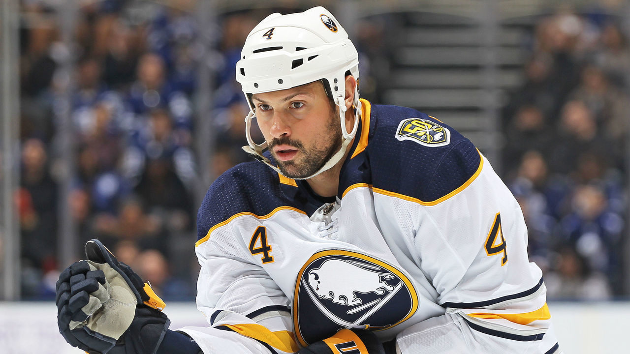 TORONTO, ON - NOVEMBER 30: Zach Bogosian #4 of the Buffalo Sabres gets set for play to resume against the Toronto Maple Leafs during an NHL game at Scotiabank Arena on November 30, 2019 in Toronto, Ontario, Canada. The Maple Leafs defeated the Sabres 2-1 in overtime.