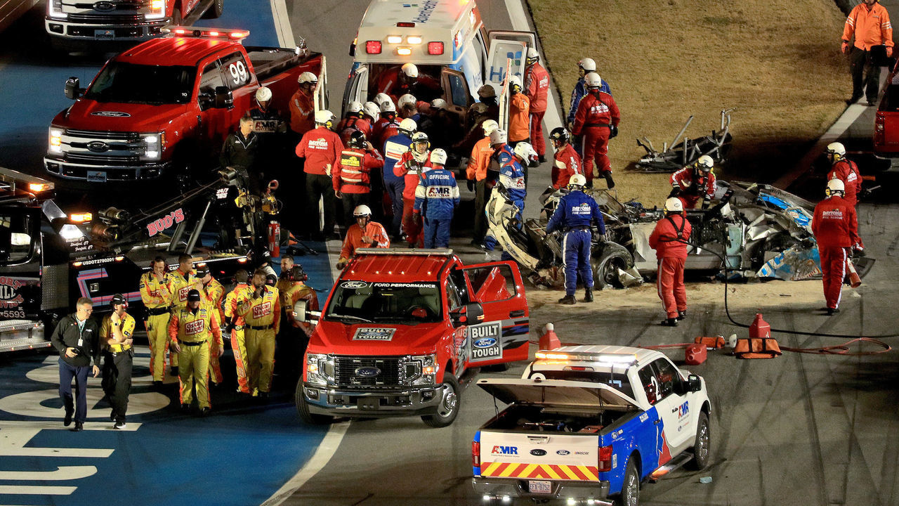 DAYTONA BEACH, FLORIDA - FEBRUARY 17: Track workers attend to Ryan Newman, driver of the #6 Koch Industries Ford, following a crash during the NASCAR Cup Series 62nd Annual Daytona 500 at Daytona International Speedway on February 17, 2020 in Daytona Beach, Florida.