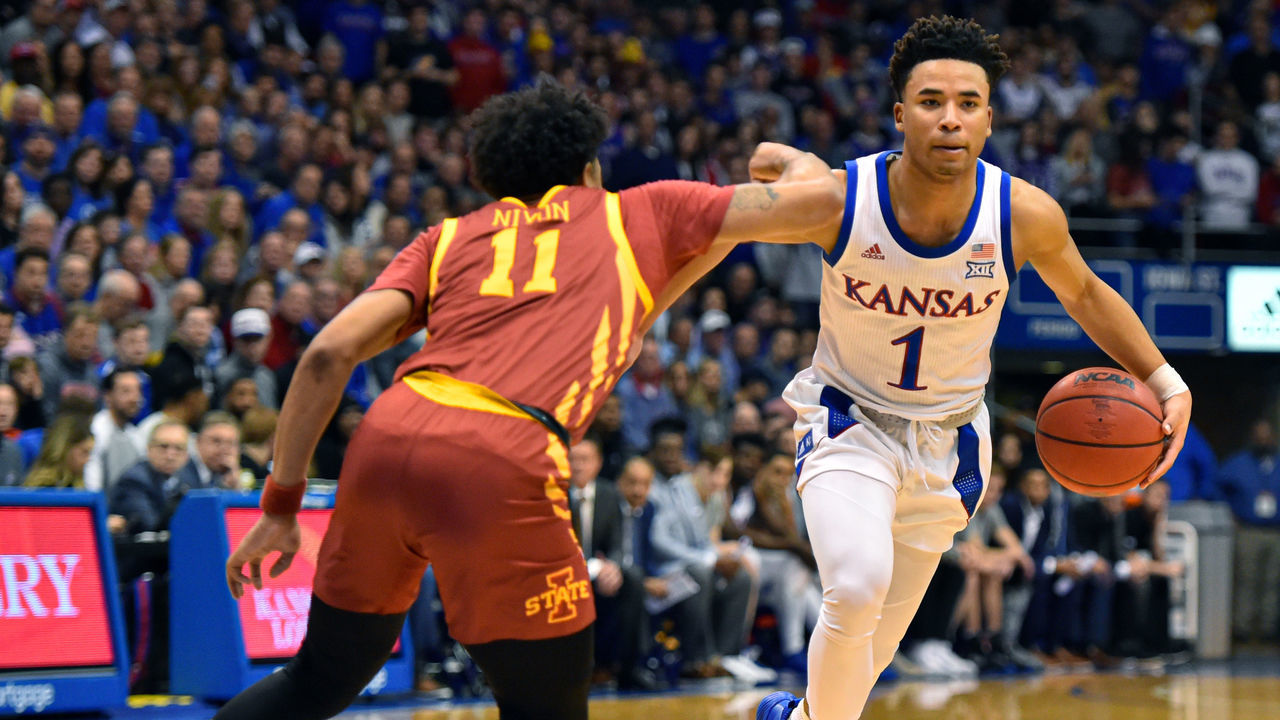 LAWRENCE, KANSAS - FEBRUARY 17: Devon Dotson #1 of the Kansas Jayhawks controls the ball against Prentiss Nixon #11 of the Iowa State Cyclones in the first half at Allen Fieldhouse on February 17, 2020 in Lawrence, Kansas.